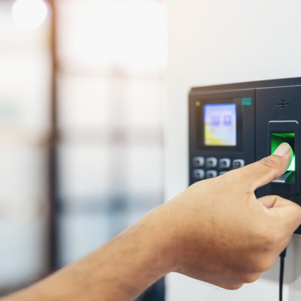 Finger print scan, Male employees press sensors to record company attendance time and after work, Time Recorder Attendance - Out work, Encryption for identity verification or electronic signing